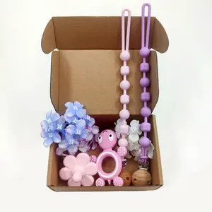 Set di giocattoli per la dentizione per bambini Clip per ciuccio catena per capezzoli Set di massaggiagengive in Silicone 4 pezzi giocattoli per la dentizione per il bambino