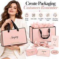 Sacs en papier de luxe personnalisés roses avec logo, poignées en ruban noir, sacs de shopping de luxe pour les boutiques de vêtements, les cosmétiques et les marques de cadeaux