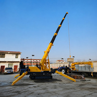 Mini-grue araignée compacte de 2 tonnes avec chenilles en caoutchouc pour travaux d'installation de murs-rideaux en verre et travaux de façade