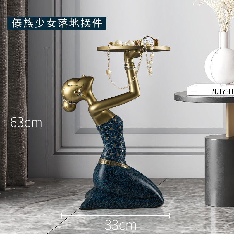 รูปปั้นหญิงสาวคุกเข่า