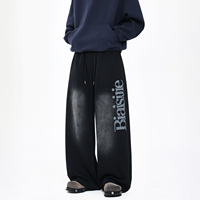 Pantalon de survêtement homme ample et polyvalent en coton foncé, coupe droite, avec imprimé lettres rétro américain tendance et taille mi-haute à cordon de serrage
