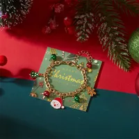 Bracelet CUMAI avec pendentifs Père Noël, bonhomme de neige, sapin et cloche pour femme – Bijou exquis réglable pour fêtes et vacances, idéal comme cadeau