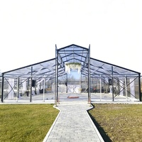Tente transparente en PVC et aluminium de style serre moderne pour mariage de luxe en plein air