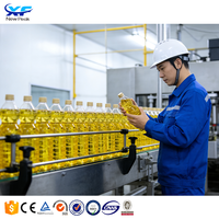 Ligne de production automatique de remplisseur d'huile de palme Machines de production d'huiles pour les fèves de cacao végétales Machine de remplissage d'huile de noix de coco comestible