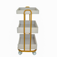 Chariot mobile de salon de maquillage de haute qualité nouveau design chariot de salon de manucure à 3 niveaux chariot de beauté en or avec roues verrouillables