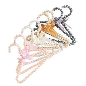 Vente <span class=keywords><strong>en</strong></span> gros de vêtements de luxe pour femmes <span class=keywords><strong>en</strong></span> plastique antidérapant perlé <span class=keywords><strong>cintre</strong></span> pour enfants bébé enfant boutique - Product Image 5