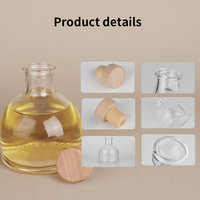 Bouteille diffuseur de parfum en verre transparent minimaliste ronde de 160 ml, vide, avec couvercle en bois naturel, par Eric Custom