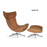 Chaise Imola Boconcept avec repose-pieds, pieds en métal massif chromé, robuste