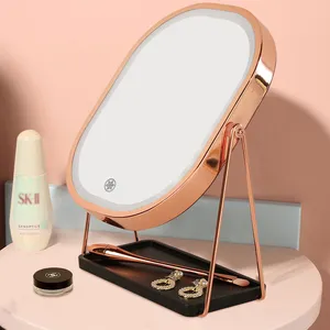 360 rotación de viaje plástico Usb recargable pantalla táctil espejo de maquillaje con luz Led 2 Comentarios