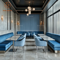Ensemble de meubles de restaurant et d'hôtel sur mesure Ron Group : table ronde en marbre élégante et chaise en velours