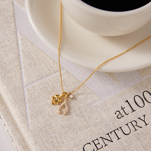 สร้อยคอจี้รูปใบโคลเวอร์สี่แฉกประดับเพชรซิร์คอน ทำจากสแตนเลสสตีล 18K พร้อมจี้รูปกระดูกอ่อน สำหรับผู้หญิง เป็นของขวัญเครื่องประดับ - Product Image 2