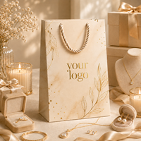 Sac de shopping en papier de luxe beige marbré avec logo doré en feuille d'or, poignée en corde tressée, emballage cadeau personnalisé OEM ODM pour bijouterie
