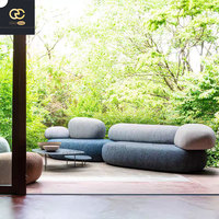 Mobilier de salon créatif et minimaliste italien: canapé en tissu galet, canapé combiné ovale pour hôtel