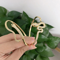 Pulsera de piel de pitón de lujo para mujer, brazalete curvo de cuerpo de serpiente, chapado en oro, latón, circón, ojos verdes, joyería