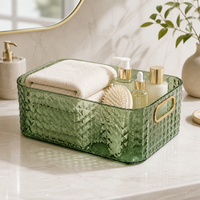 Panier de rangement transparent haut de gamme avec poignées dorées et design empilable pour maquillage, cosmétiques et articles de toilette