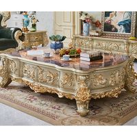 Table basse en bois massif artisanal, finition or antique, meuble décoratif de luxe pour salon