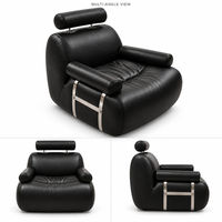 Fauteuil d'appoint en cuir noir rembourré avec appui-tête cylindrique et accoudoirs métalliques pour salon et hôtel