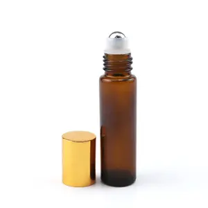 10 ml 10 ml rotolo vuoto su bottiglia di rullo di olio essenziale di vetro ambrato profumo di cristallo liptint con supporto a sfera in metallo con tappo in oro rosa