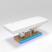 Table de massage électrique à 4 moteurs avec éclairage LED, colonne en acier inoxydable et base en bois, pour salon de tatouage et spa – Vente en gros usine