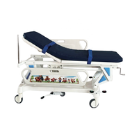 Lit de transfert hospitalier pédiatrique réglable avec support de perfusion, construction métallique, design moderne, pliable, avec roulettes de guidage