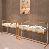 Vitrine à bijoux en or sur pied personnalisée en acier inoxydable avec éclairage LED pour magasin de bijoux