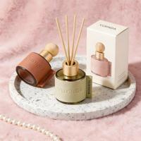 Flacons diffuseurs de parfum en verre rond de luxe de 30 ml, 50 ml et 100 ml pour désodorisants avec bâtonnets et couvercle en bois personnalisé