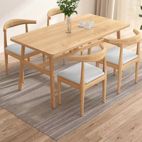 Ensemble table et chaises design moderne et épuré en fer et bambou, style corne de taureau, pour petits appartements et salons, vente en gros usine