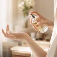 Flacon de parfum rond en verre vide de luxe de 50 ml, rechargeable, avec pulvérisateur à pompe, design personnalisé en option
