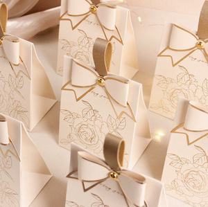 New cream-white <b>wedding</b> candy <b>box</b> with a retro French-style hand-held champagne-colored bow texture candy <b>box</b> design - Product Image 1
