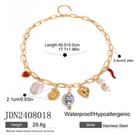 Collier en acier inoxydable plaqué or PVD 18 carats avec cœur en céramique corail étoile de mer conque escargot de mer poisson perle coquille océan