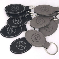Porte-clés ovales vierges en similicuir laserable à fort contraste, personnalisables en gros avec logo pour l'image de marque des entreprises