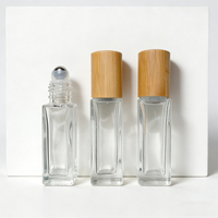 Bouteille roulante transparente personnalisée avec bouchon en bambou Bouteille roulante en verre pour huile essentielle avec billes roulantes en acier inoxydable