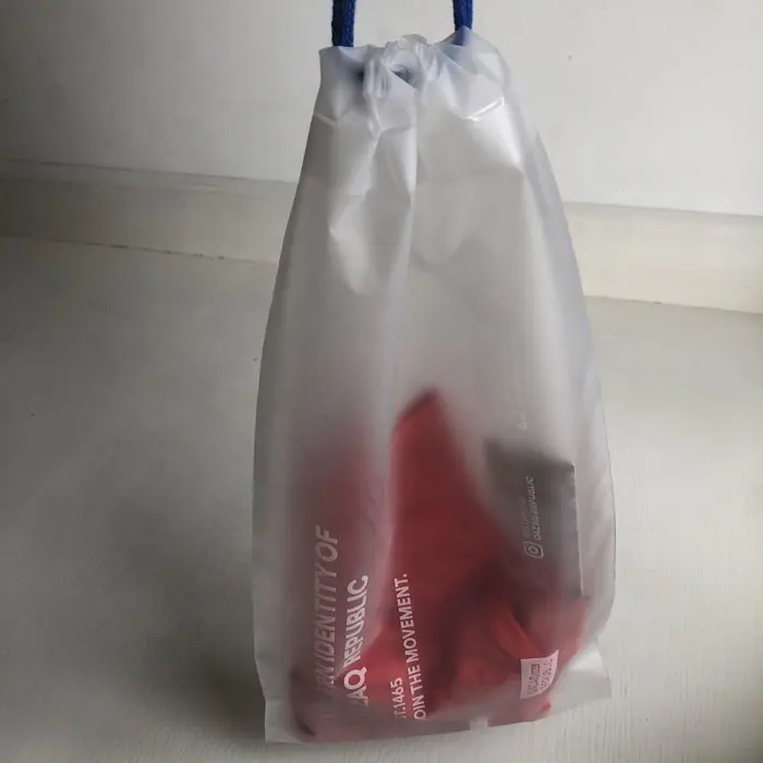 no minimum luxury semi transparent CPE plastic clothing carring custom drawstring bags