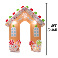 Arche gonflable en forme de maison de pain d'épices de Noël avec des bâtons de sucre et des sucettes pour la décoration d'entrée d'événements festifs