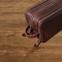 Trousse de toilette portable en cuir véritable pour transporter les essentiels quotidiens en voyage