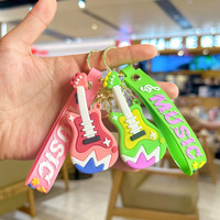 Porte-clés mini guitare premium avec breloque instrument de dessin animé et dragonne imprimée pour cadeaux souvenirs musicaux