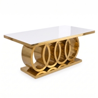 Table de banquet rectangulaire moderne en acier inoxydable à quatre anneaux creux avec plateau en marbre et verre pour hôtel