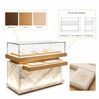 Comptoir de présentation de bijoux personnalisé en bois et marbre avec vitrine en verre éclairée pour magasin de bijoux en gros