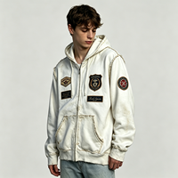 Sweat à capuche zippé effet vieilli, style streetwear épais, avec patchs et bords déchirés, blanc, pour homme, vente en gros par lot