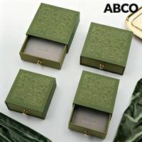 Boîte d'emballage carrée coulissante en papier de luxe Boucle en métal à motifs Boucle d'oreille Bague Pendentif Boîte à tiroir cadeau pour bijoux avec insert en mousse
