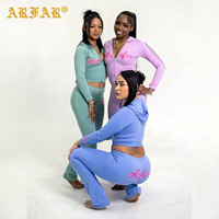 Fabricant de vêtements de sport sur mesure : Ensemble de vêtements de sport pour femme, comprenant une veste à capuche zippée sans couture pour le yoga et un legging de fitness effet push-up, pour la salle de sport.