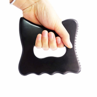 Outil de massage Gua Sha en pierre de Bian noire naturelle avec pointe de déclenchement et bord lisse pour la physiothérapie et la thérapie par acupuncture en SPA