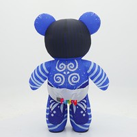 Costume de mascotte gonflable d'ours bébé imprimé sur mesure avec motif bleu, sucette et couche pour spectacle de festival