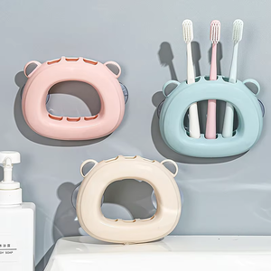 Support mural créatif en plastique à ventouse pour brosses à dents, 3 emplacements, sans perçage, avec crochets pour salle de bain - Product Image 1