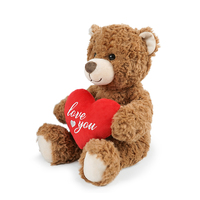 Un ours en peluche de haute qualité tenant un objet en forme de cœur pour exprimer l'amour.