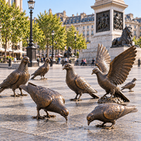 statues de pigeons en bronze