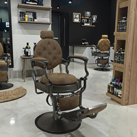 Mobilier de salon de beauté en cuir brun de luxe chaise de coiffure de salon à base ronde noire chaise de barbier à usage intensif pour la vente en gros