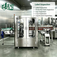 Système automatique d'inspection de la qualité des bouteilles de vin pour la production de spiritueux avec impression de la position de l'étiquette et vérification de l'alignement du bouchon