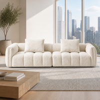 Canapé modulaire Urban Skyline moderne en bouclette crème, garni d'éponge, capitonné, profil bas, idéal pour les salons d'appartements en immeubles de grande hauteur