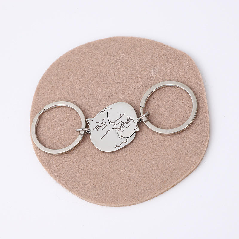 A pair of steel color + steel color keychains